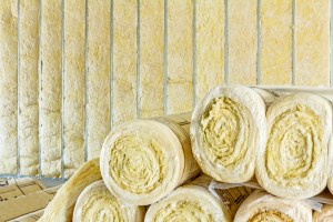Stack of thermal insulation material in roll is wrapped with cellophane foil iStock 660630810